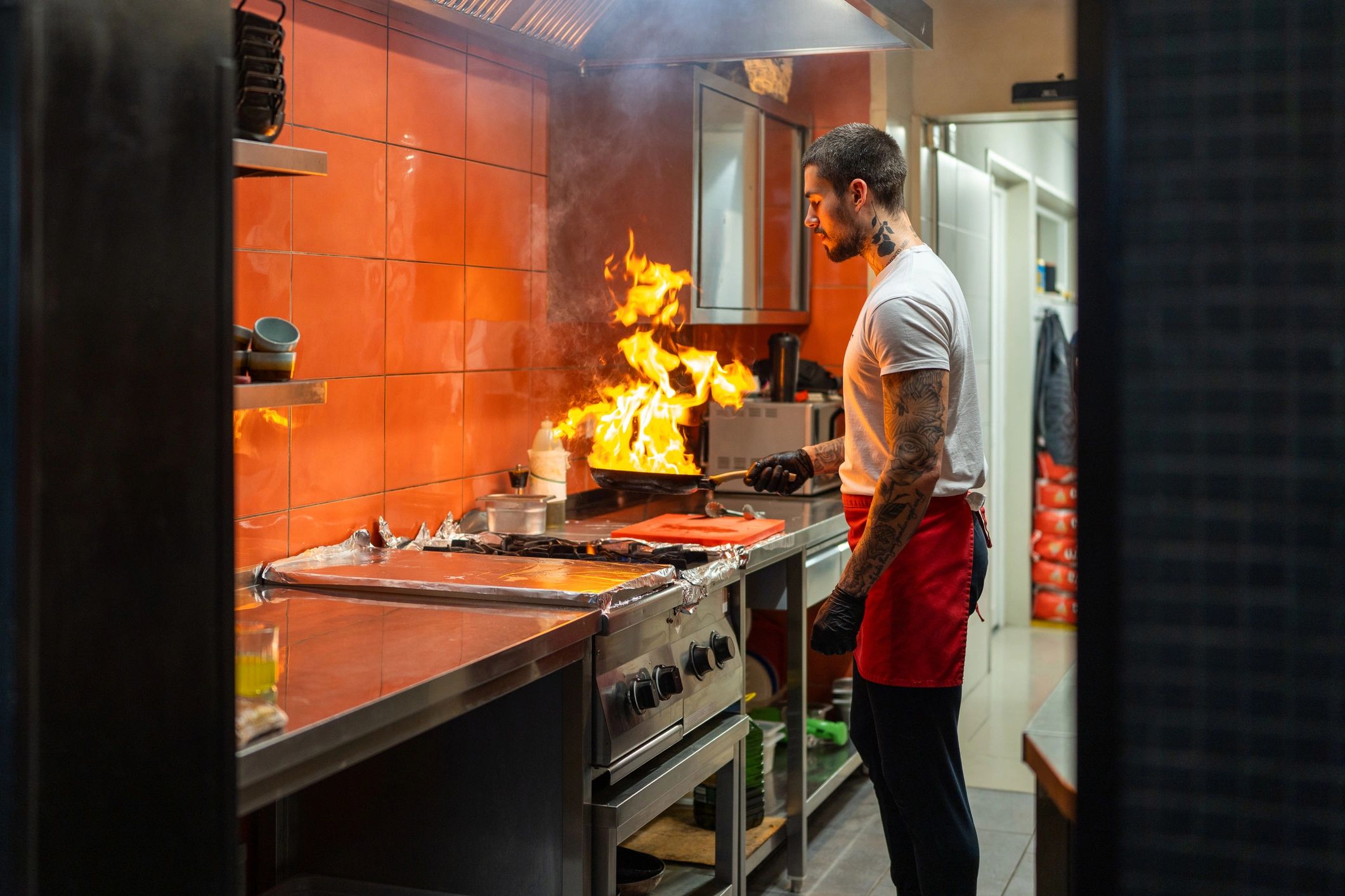 Chef preparing steak in a professional kitchen